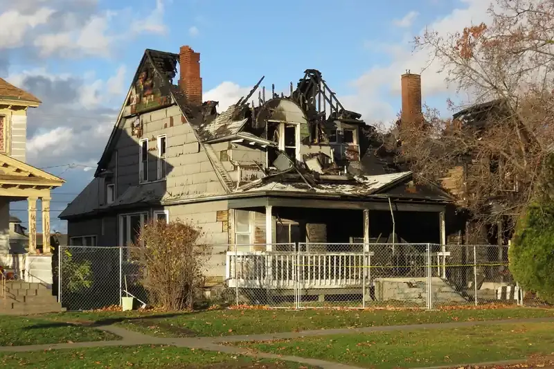 Two-story house with its roof and upper floor burned out